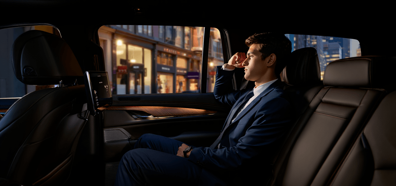Business executive enjoying luxury ride in GSALux black car